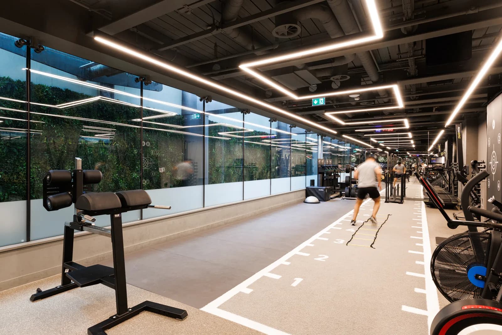 UNTIL Bond Street gym with a sprint track, living green wall and strength equipment.