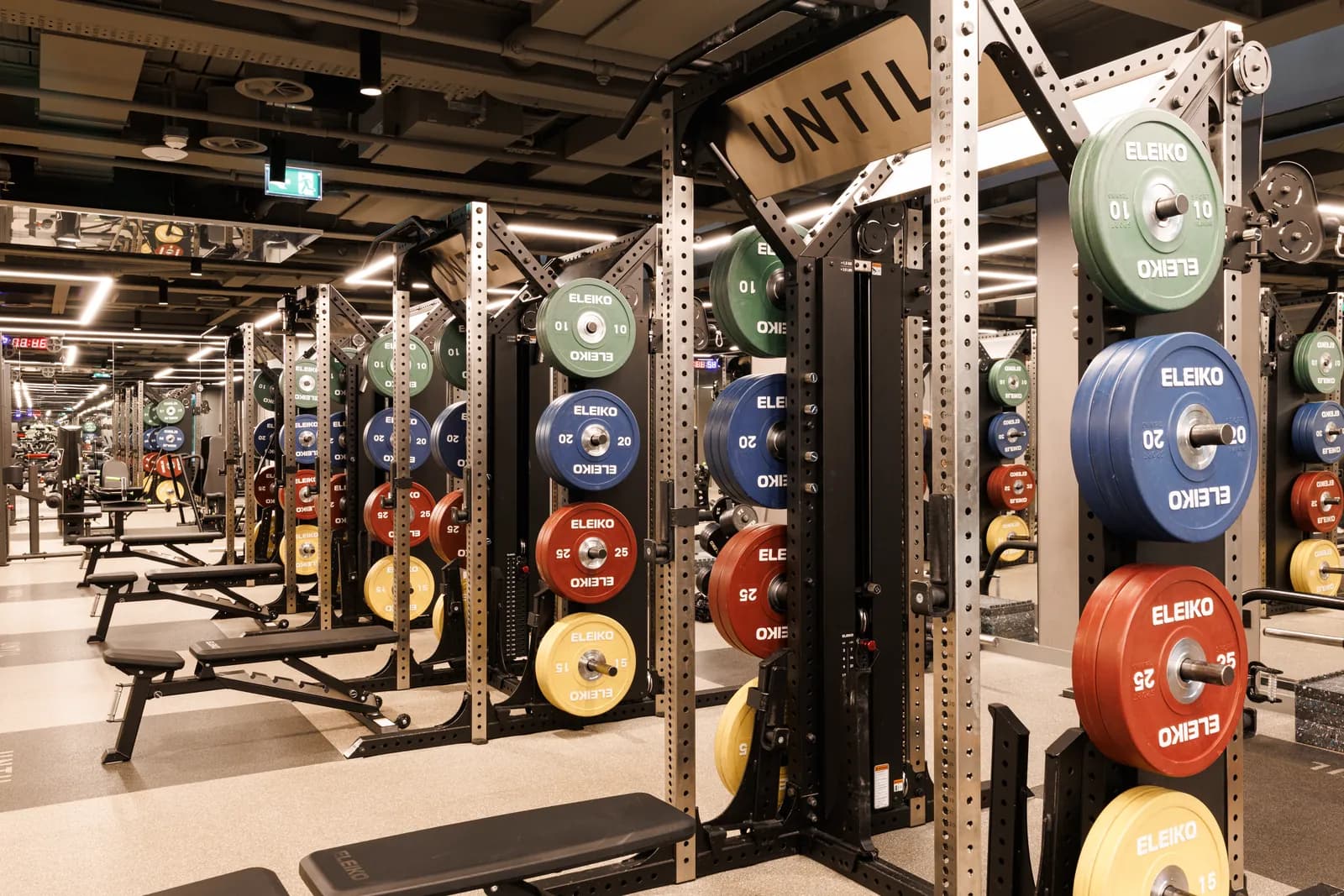 UNTIL Bond Street gym floor with Eleiko plate-loaded racks and free weights.