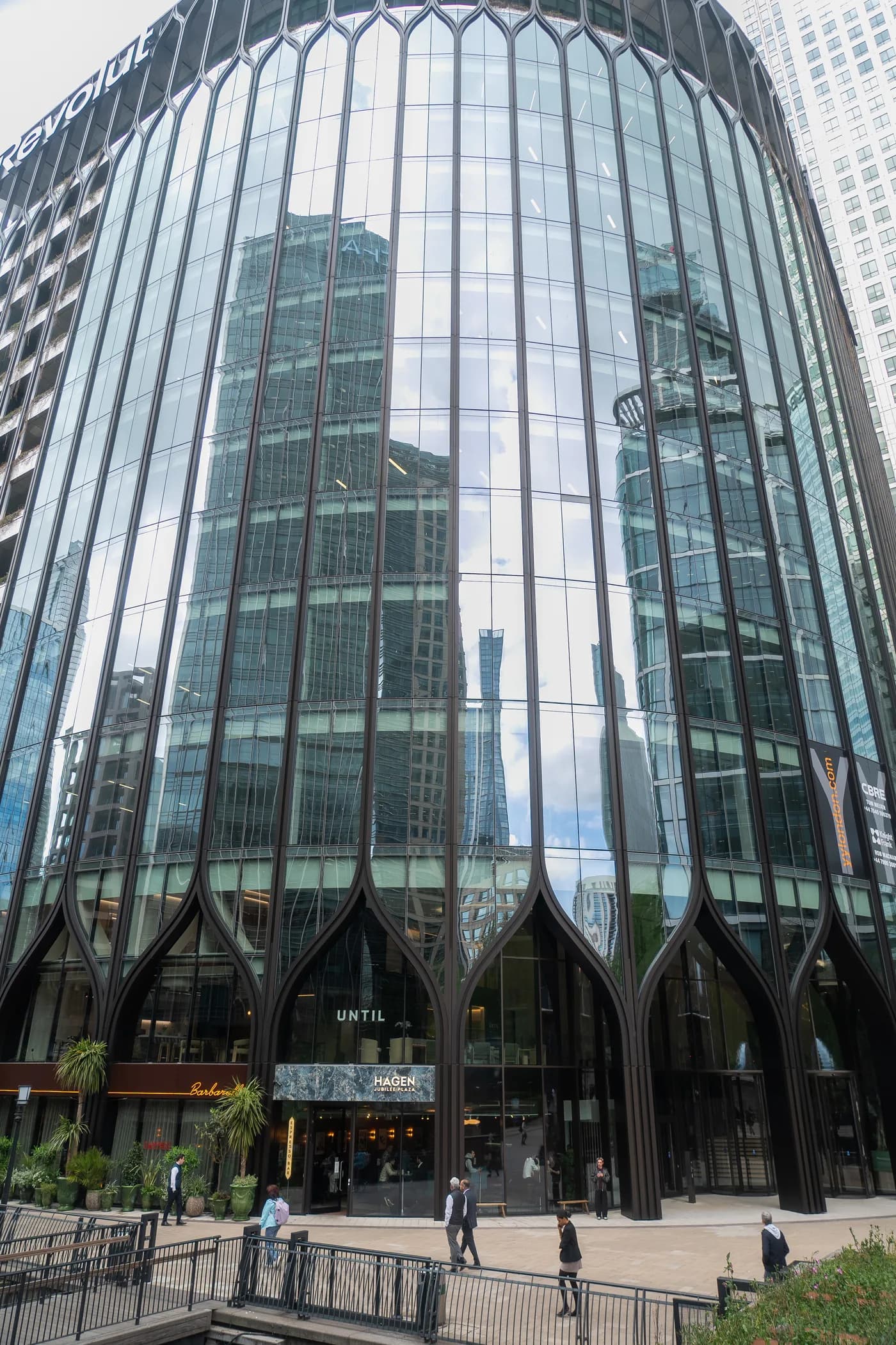 The Revolut / UNTIL building at 30 South Colonnade, Canary Wharf, viewed from street level.