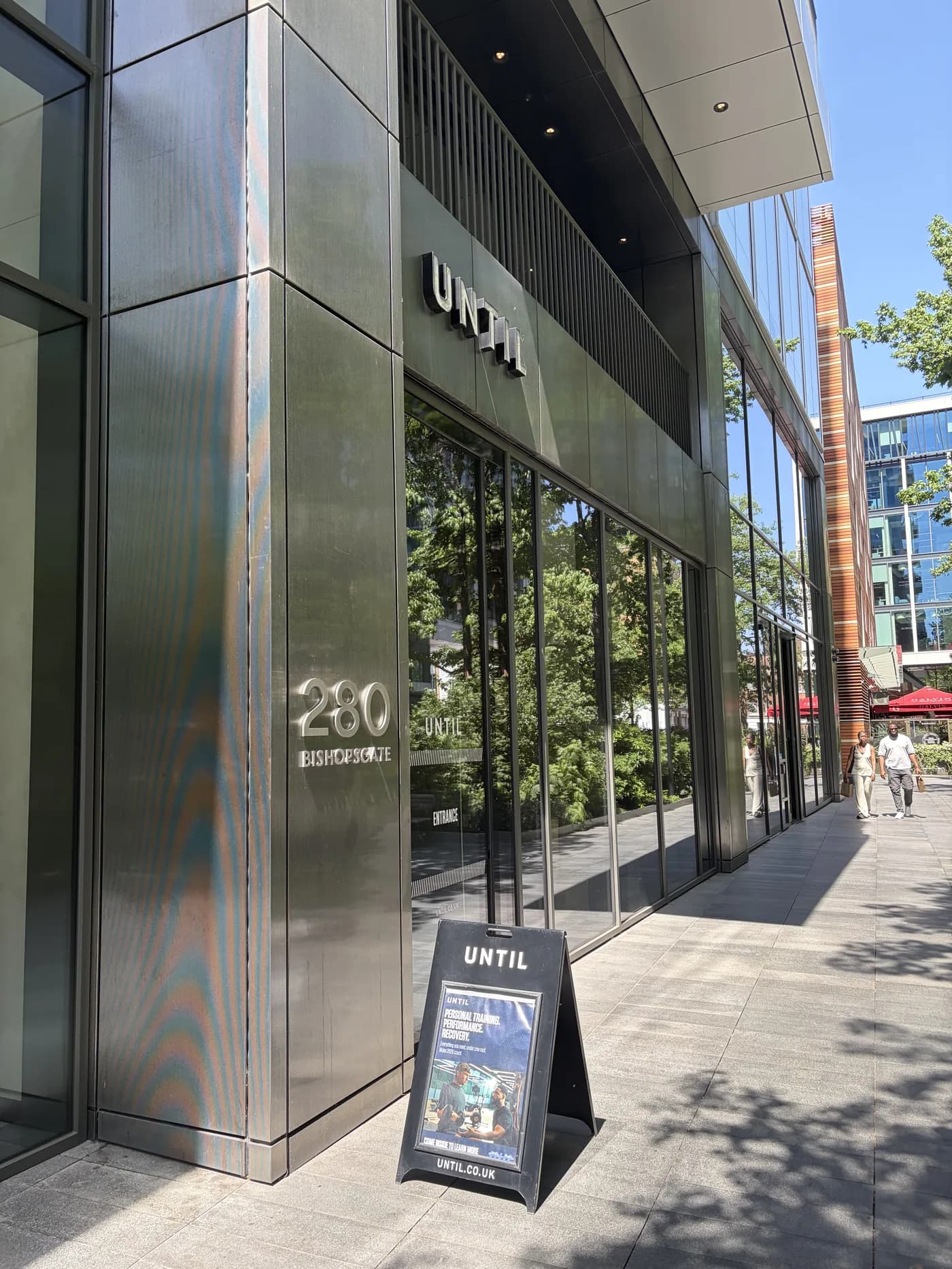 UNTIL signage at 280 Bishopsgate, the entrance to Atlas Osteopathy Liverpool Street.