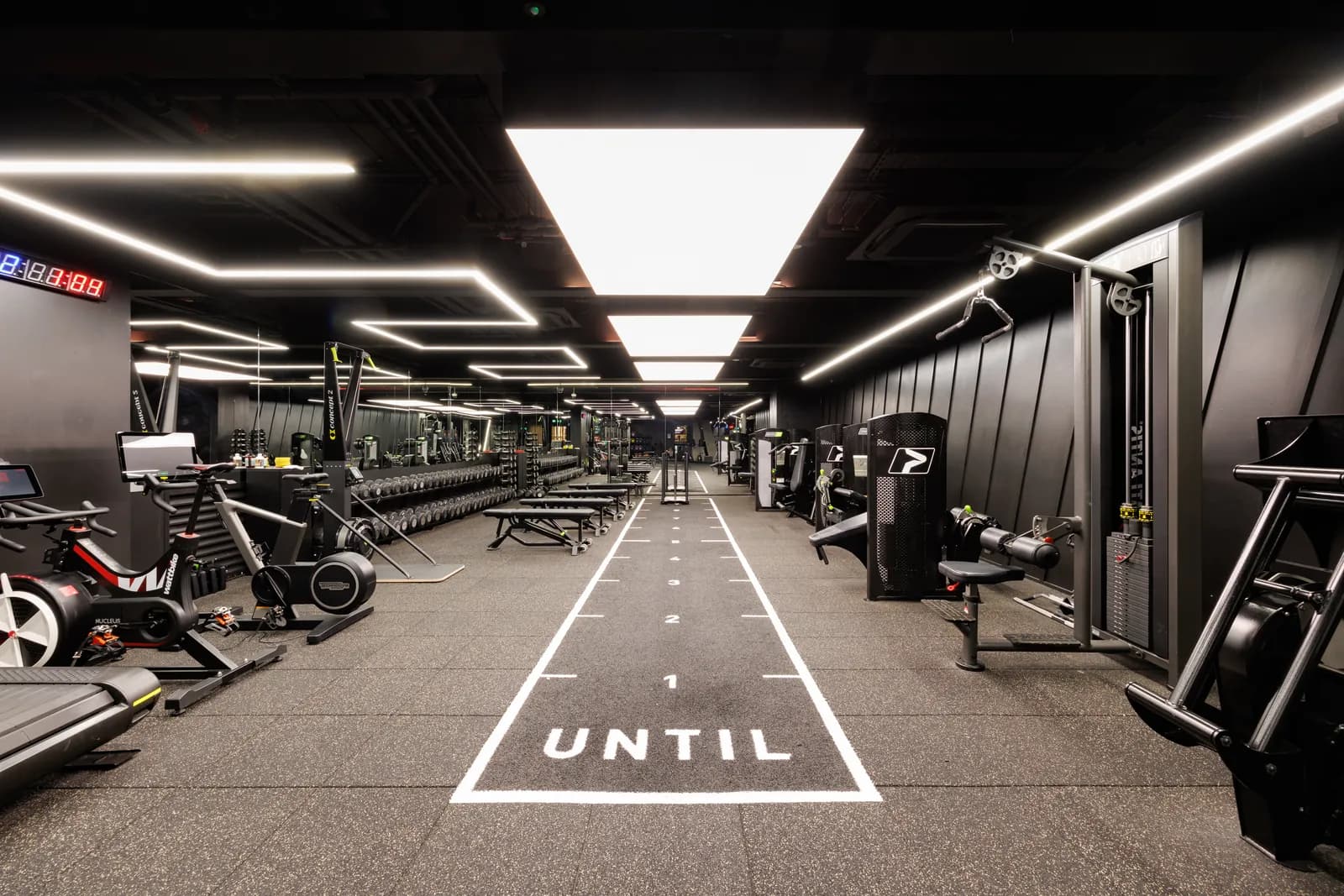 UNTIL Liverpool Street gym floor with a sprint track, treadmills and free weights.